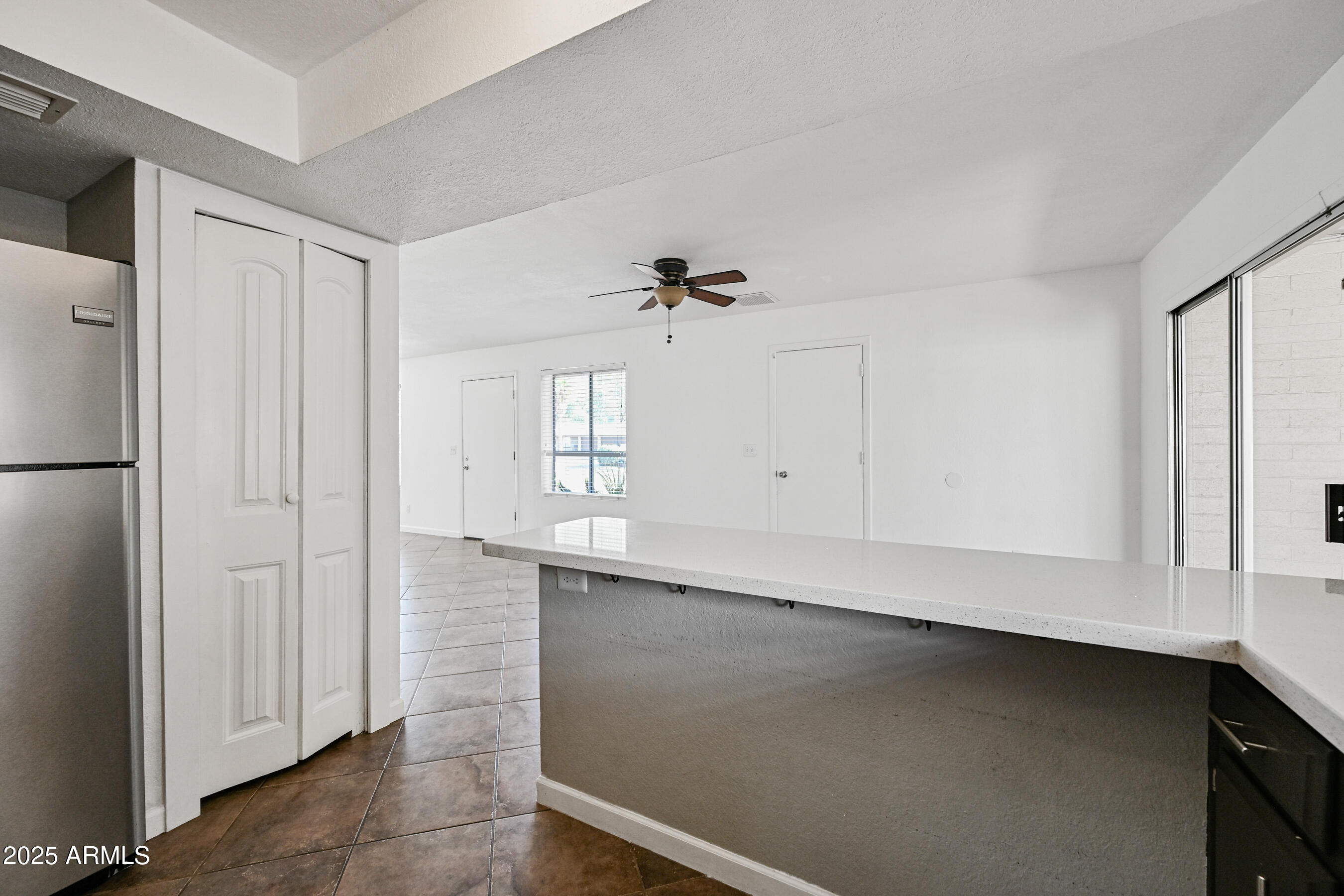 5558 West Cortez Street Glendale, AZ 85304 - Photo 13 of 34 a view of an empty room with a window