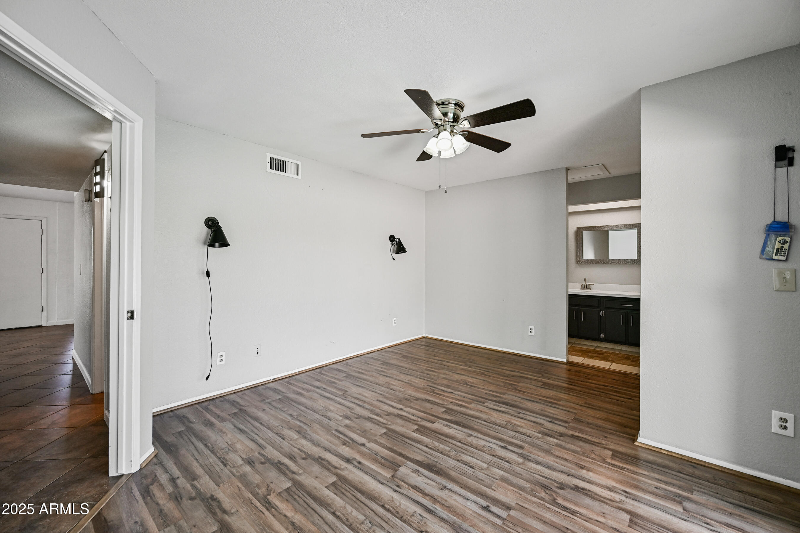 5558 West Cortez Street Glendale, AZ 85304 - Photo 24 of 34 a view of empty room with wooden floor