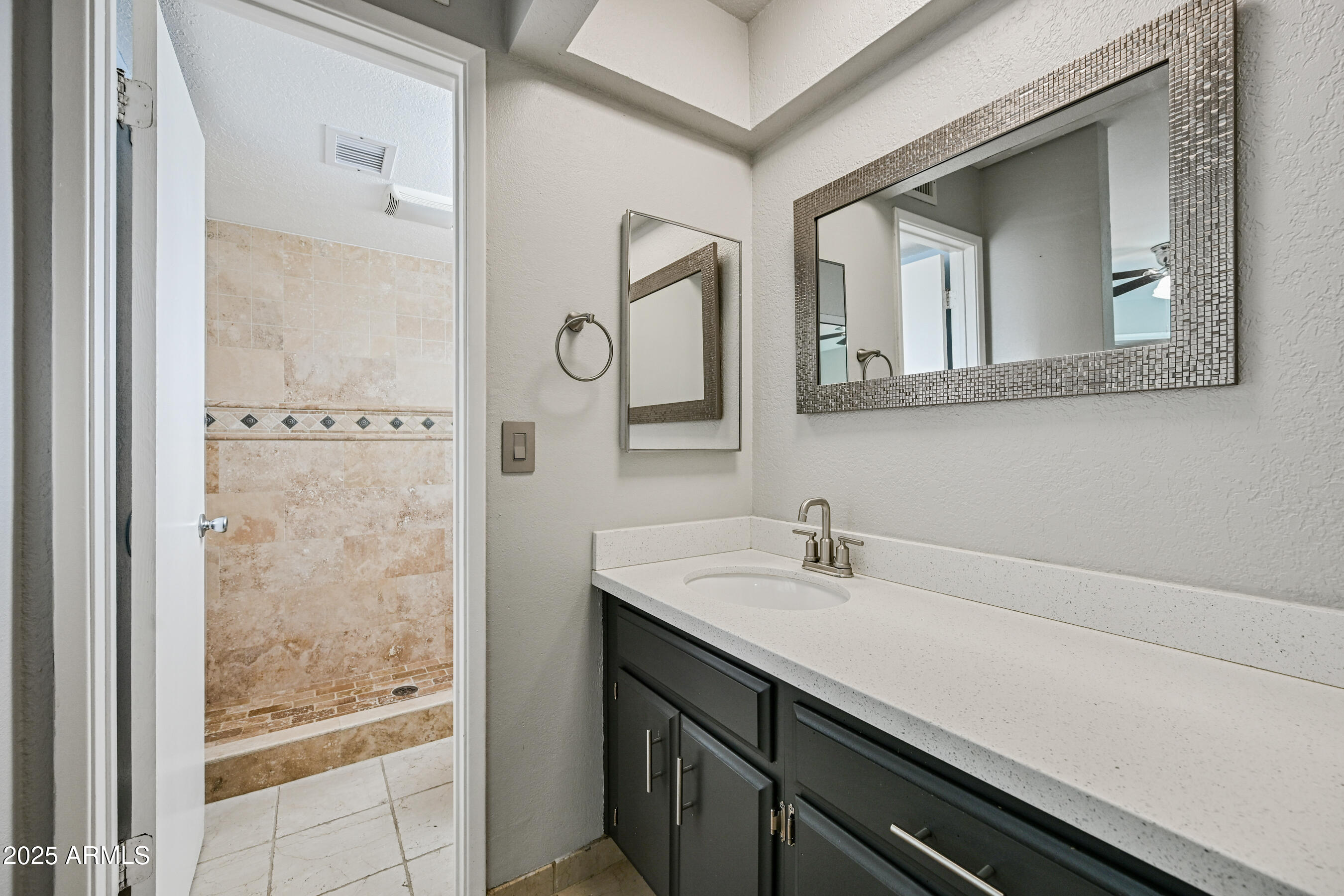 5558 West Cortez Street Glendale, AZ 85304 - Photo 25 of 34 a bathroom with a sink and a mirror