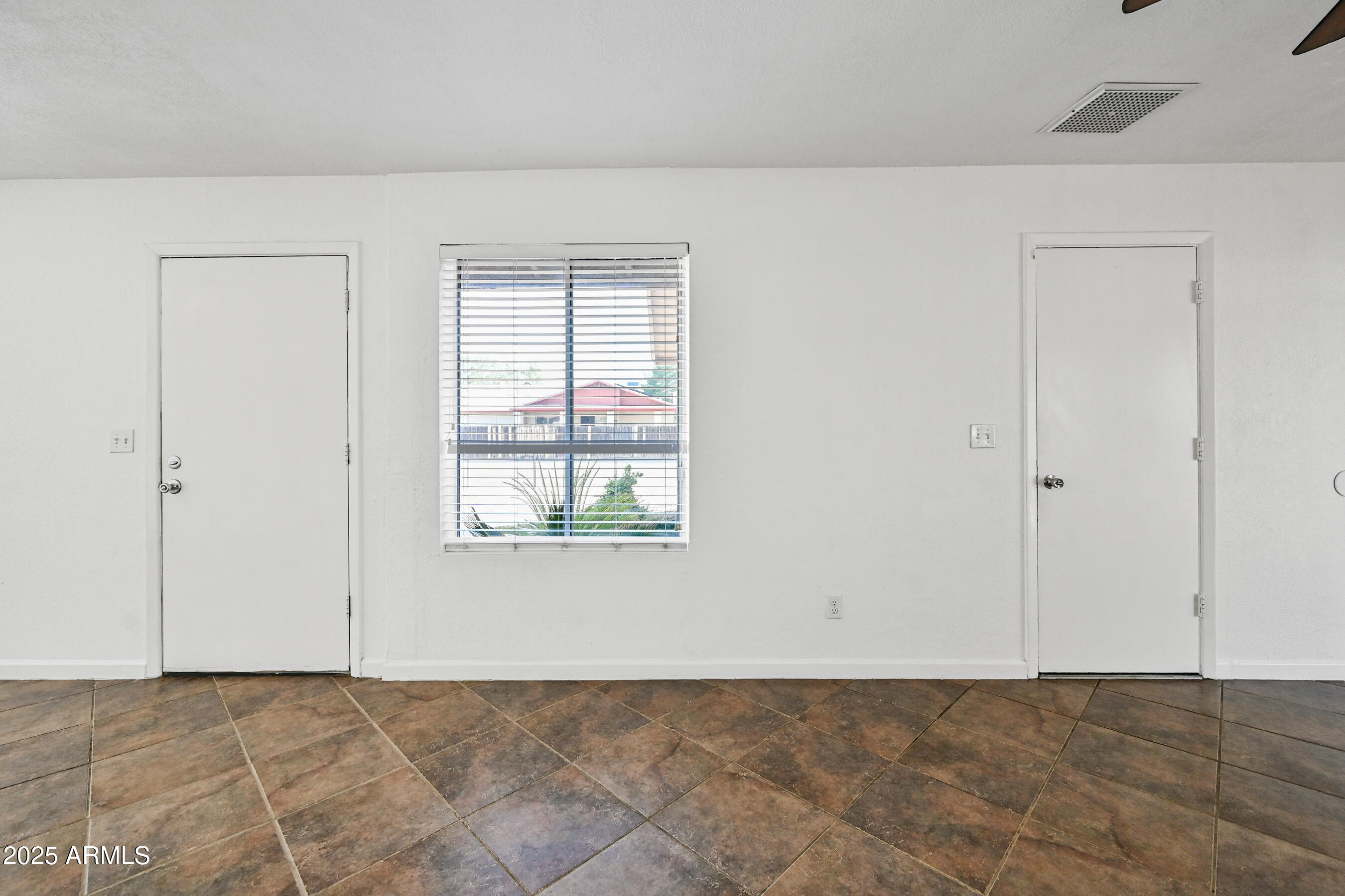 5558 West Cortez Street Glendale, AZ 85304 - Photo 31 of 34 a view of an empty room with a window