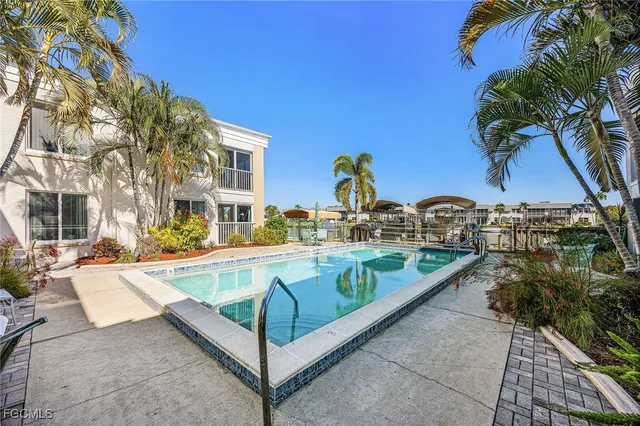 a view of a swimming pool with a lounge chairs