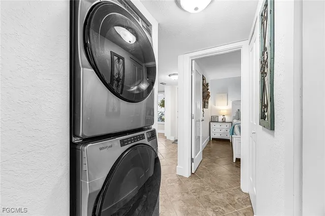 a view of a hallway with washer and dryer