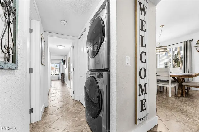 a view of a hallway with washer and dryer