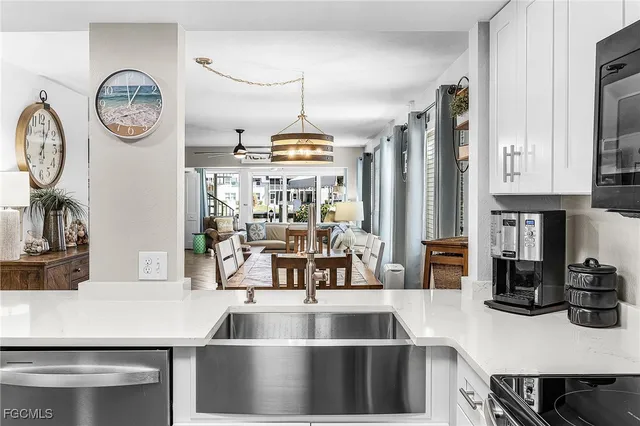 a kitchen with a table chairs and a stove