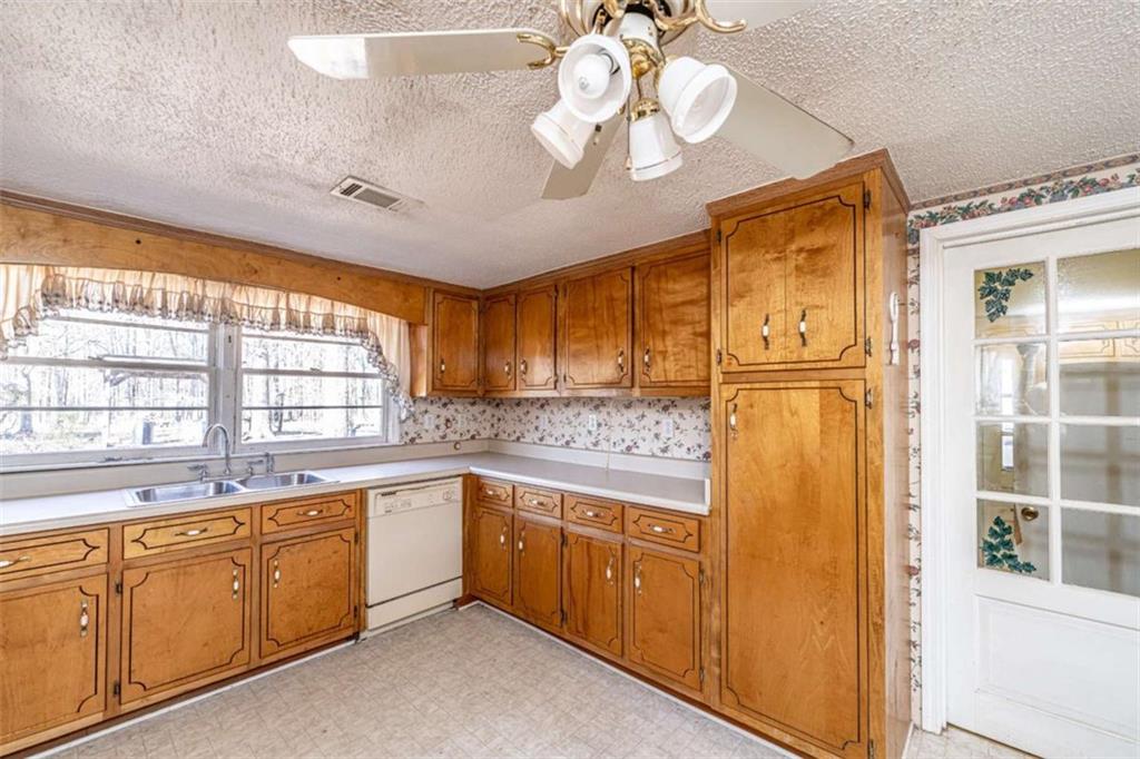 4383 Martha Berry Highway Rome, GA 30165 - Photo 11 of 27 a kitchen with a sink and cabinets