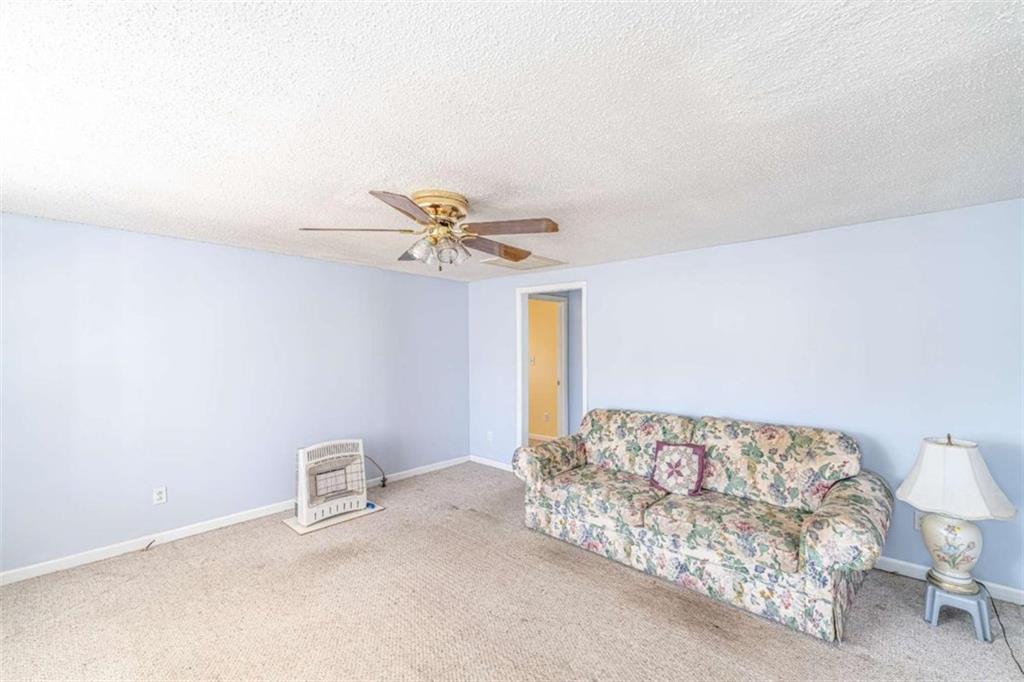 4383 Martha Berry Highway Rome, GA 30165 - Photo 5 of 27 a bedroom with a bed and a chandelier