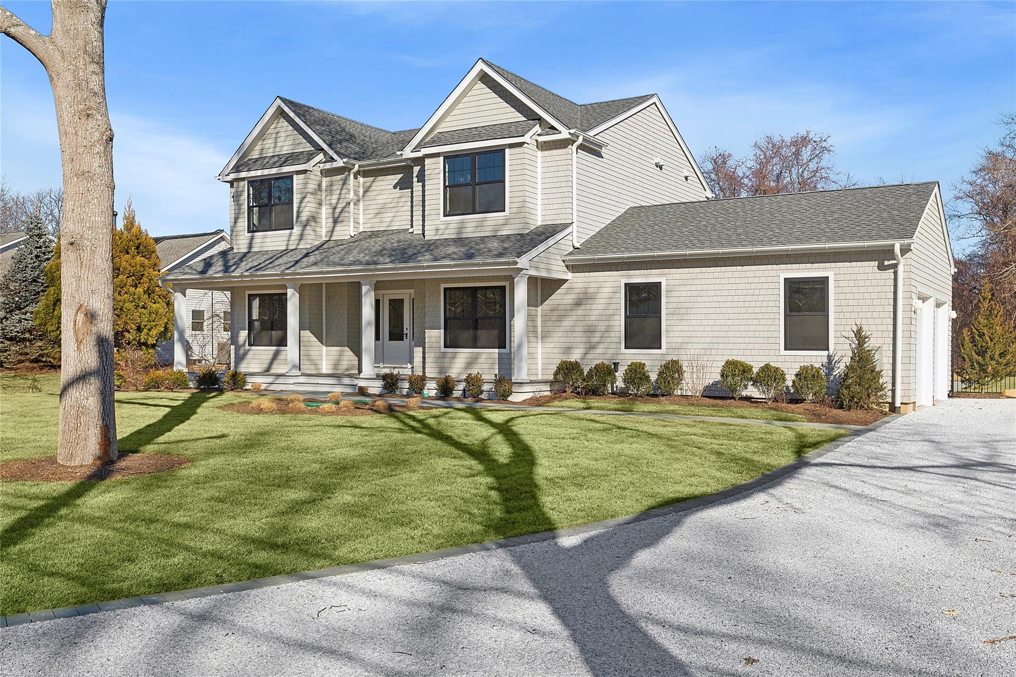 a front view of a house with swimming pool having outdoor seating