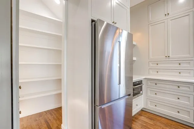 a kitchen with granite countertop a stove and a sink