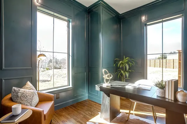 a dining room with furniture and wooden floor