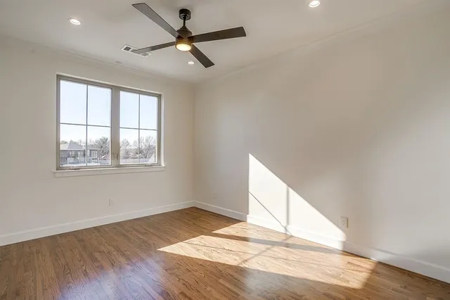 a bathroom with a granite countertop sink toilet a mirror and bathtub