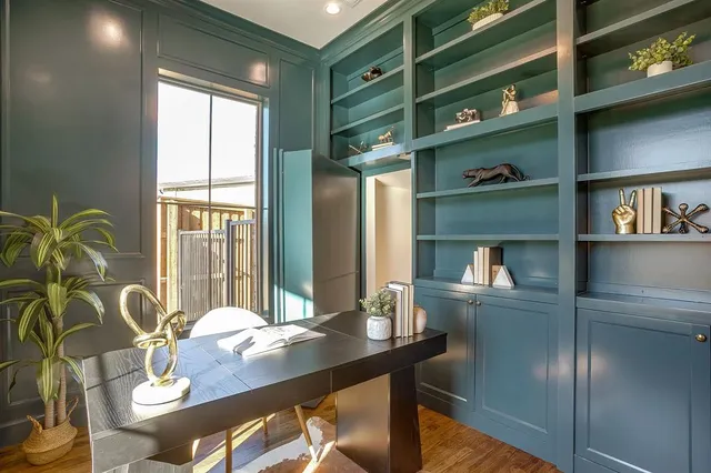 a dining room with furniture and window