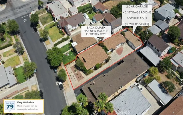 an aerial view of a residential apartment building with a yard