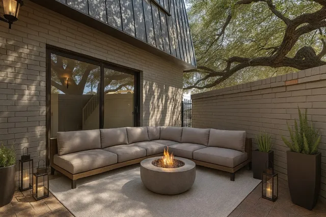 a view of a patio with couches and a potted plant on a table