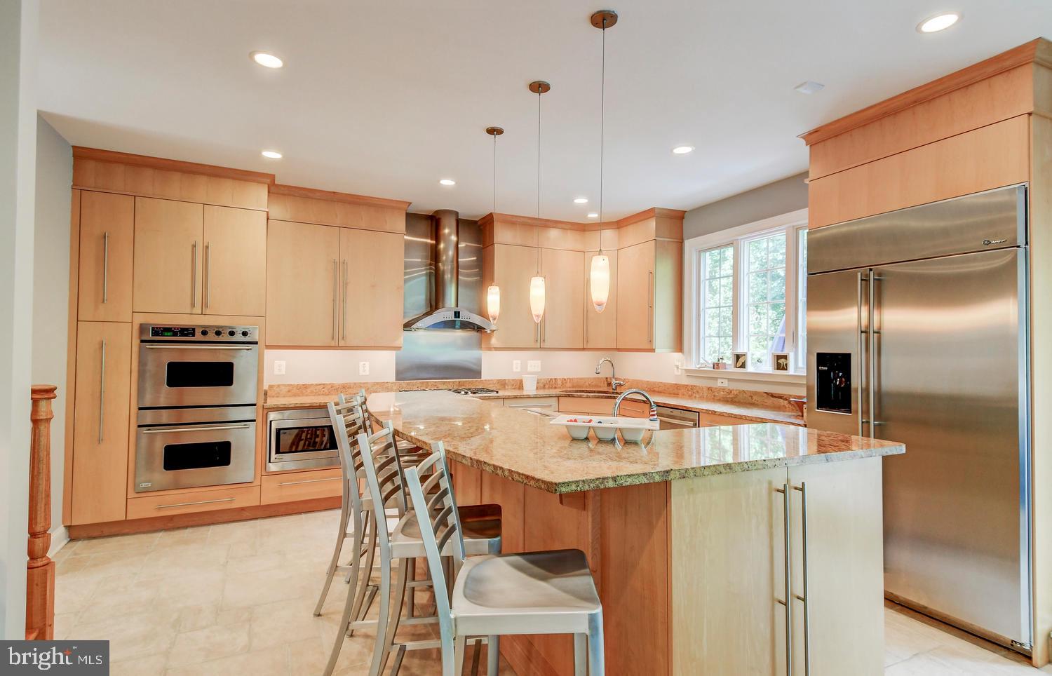 4004 Cloverland Drive Phoenix, MD 21131 - Photo 22 of 60 TIERED CENTER ISLAND HAS UPGRADED PENDANT LIGHTING