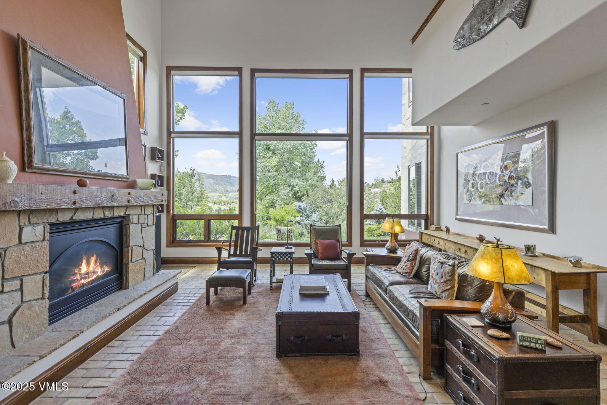 225 Alcazar Drive Edwards, CO 81632 - Photo 2 of 39 a living room with furniture large window and a fireplace