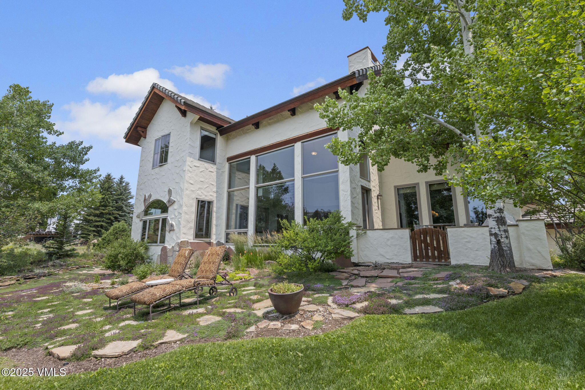 225 Alcazar Drive Edwards, CO 81632 - Photo 27 of 39 a front view of a house with garden