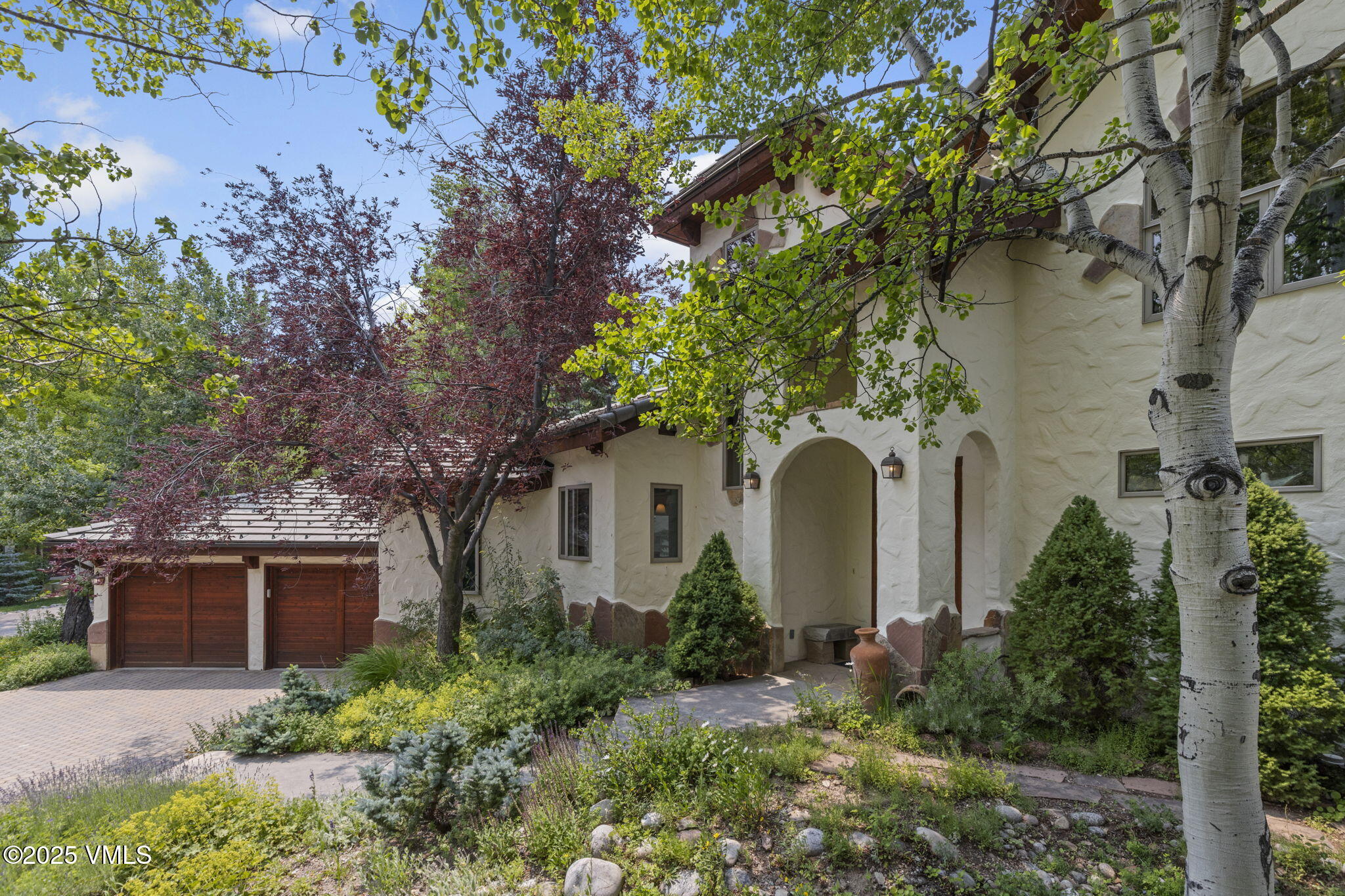 225 Alcazar Drive Edwards, CO 81632 - Photo 32 of 39 a front view of a house with garden