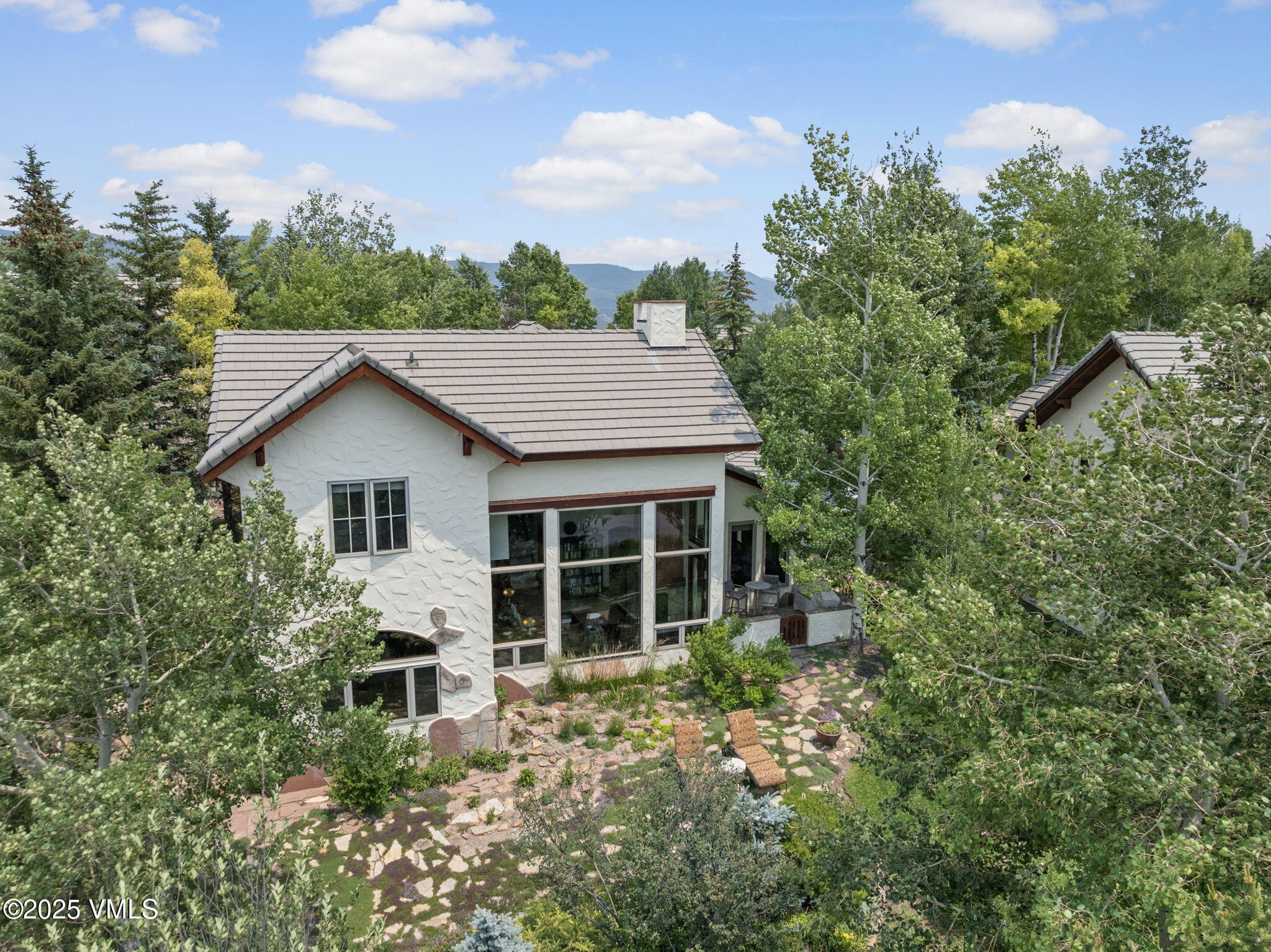 225 Alcazar Drive Edwards, CO 81632 - Photo 37 of 39 a aerial view of a house with yard and trees in the background