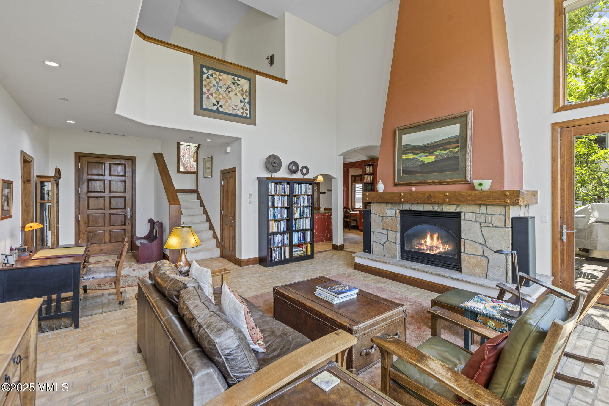 225 Alcazar Drive Edwards, CO 81632 - Photo 4 of 39 a living room with furniture a flat screen tv and a fireplace