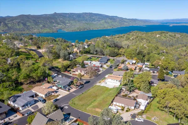 an aerial view of residential house with outdoor space and mountain view