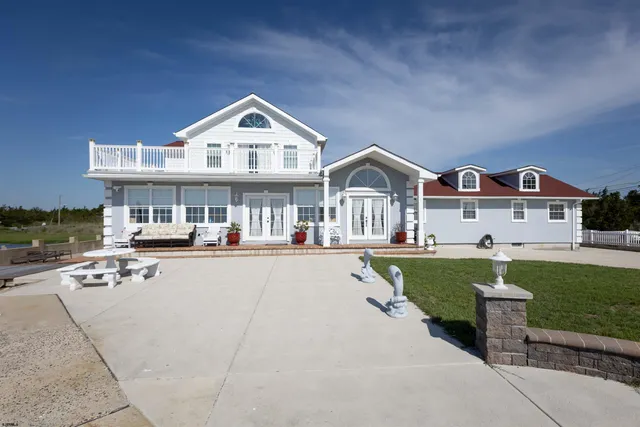 a view of house with outdoor space and swimming pool