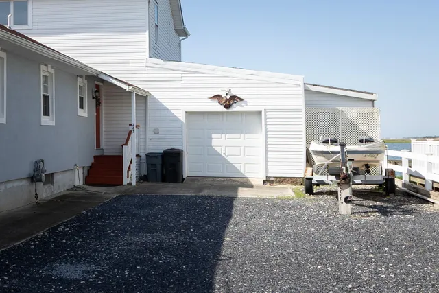 a living room with furniture a fireplace and a table