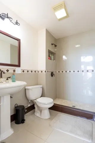 a bathroom with a toilet and a sink