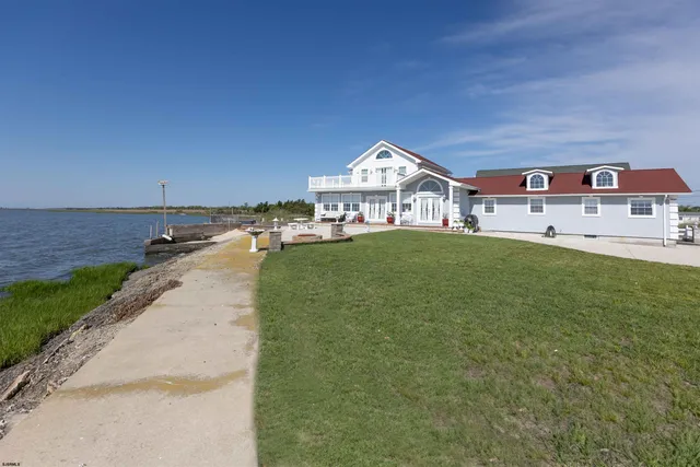 a view of balcony with wooden floor and fence