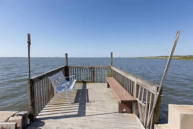 a view of a swimming pool with a lounge chair