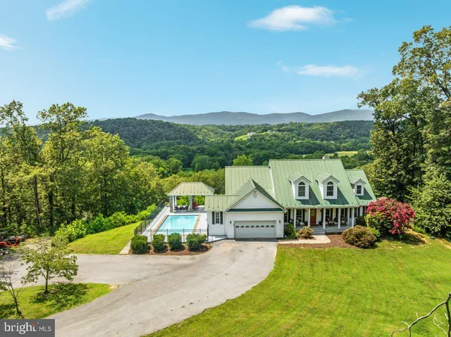 a view of houses with an outdoor space and seating