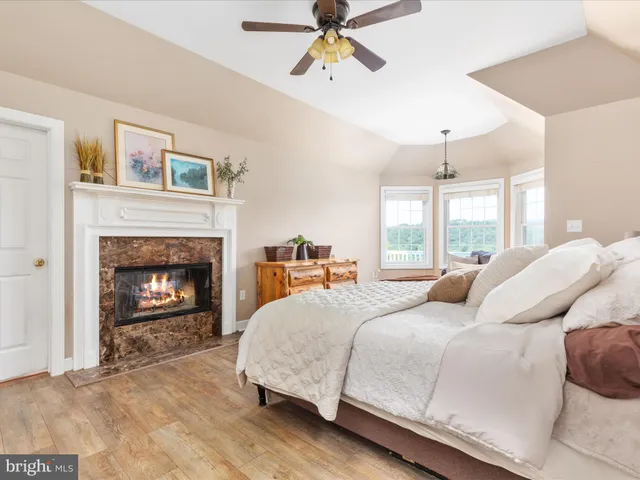 a bathroom with a bathtub sink and mirror