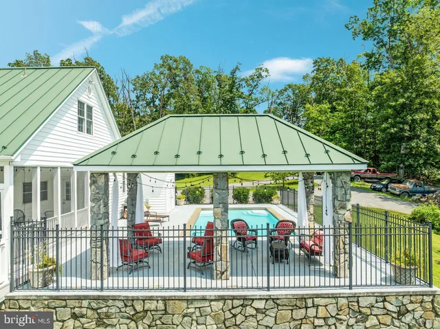 an aerial view of a house with a garden