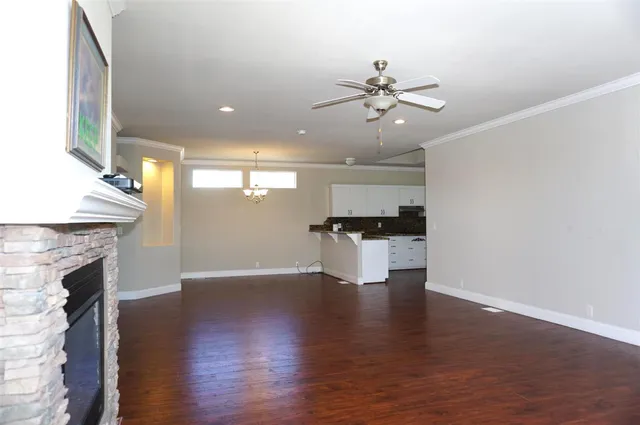 a view of a kitchen with a sink and a fireplace