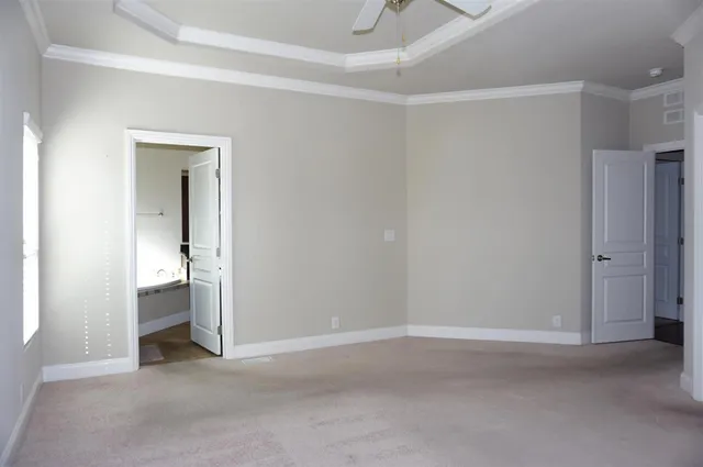 a view of an empty room and closet