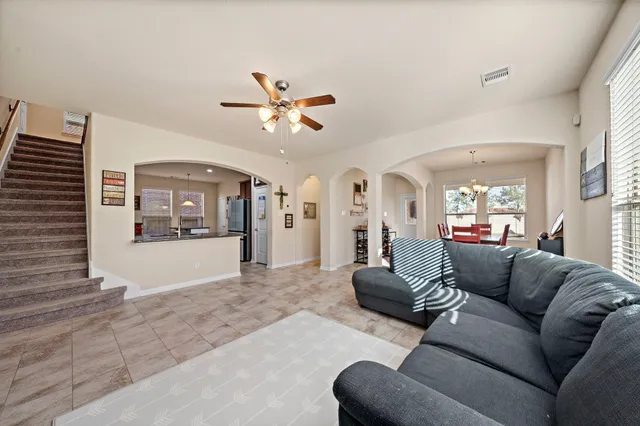 a living room with furniture and a large window