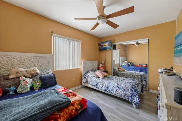 a bedroom with bed and a window