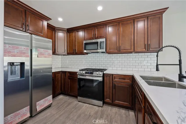 a view of a blue house with a yard