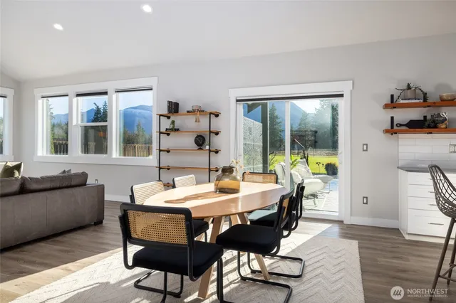 a view of a dining room with furniture window and wooden floor