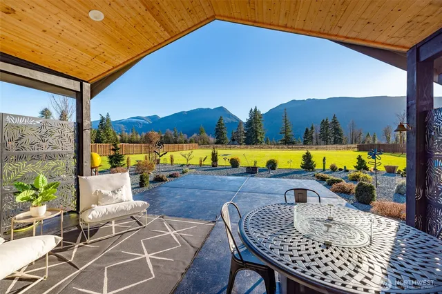 a view of swimming pool with outdoor seating space