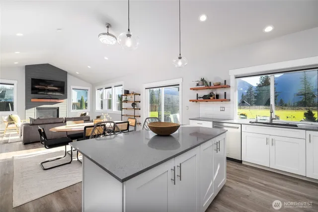 a kitchen with stainless steel appliances granite countertop a stove and a sink
