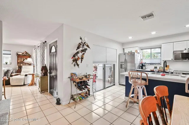 a view of a dining room kitchen and furniture