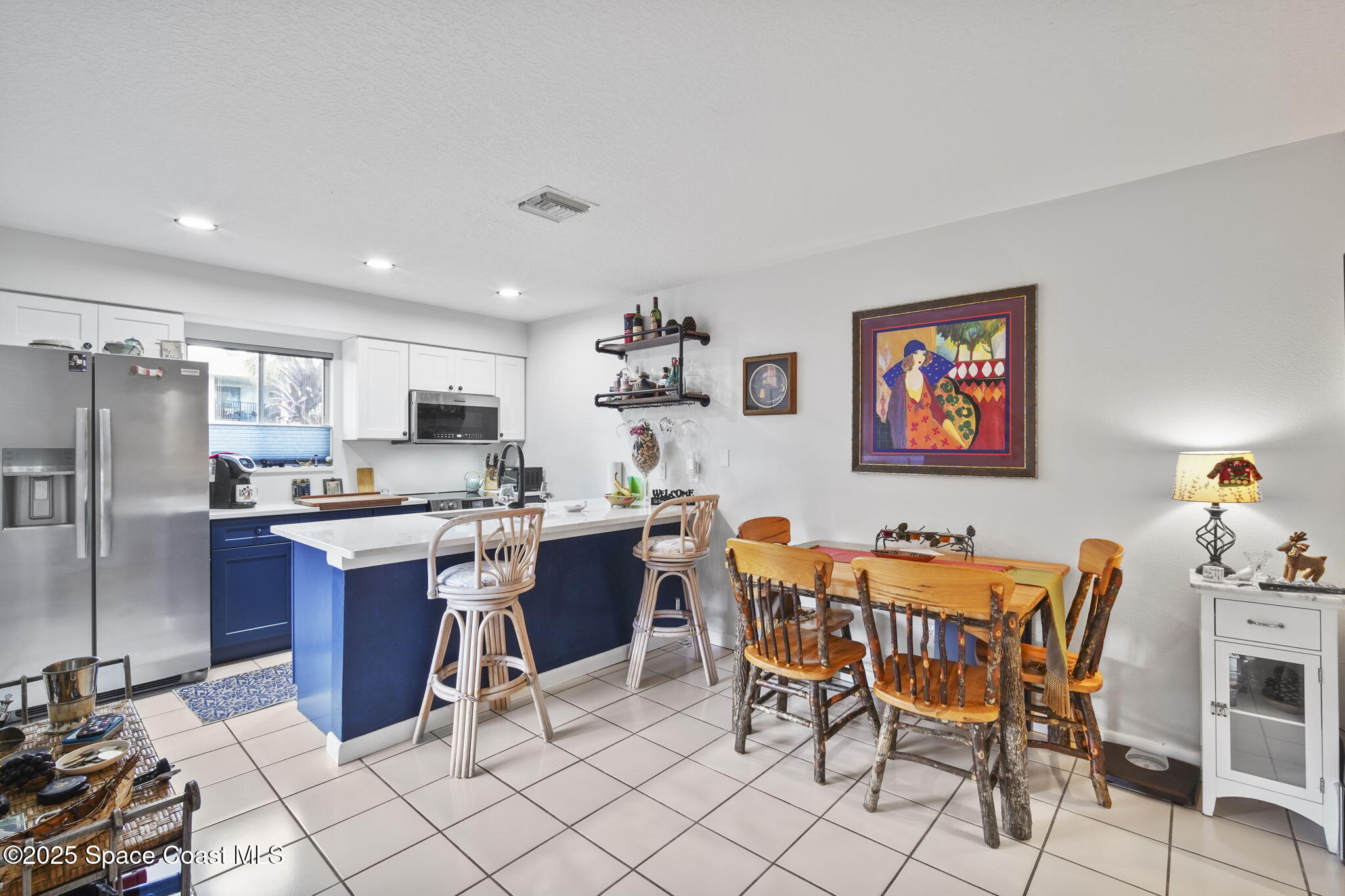 4148 Prime Avenue, Unit 1504 Rockledge, FL 32955 - Photo 12 of 30 a view of a dining room with furniture