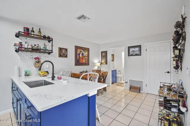 a view of a kitchen with a sink and cabinets