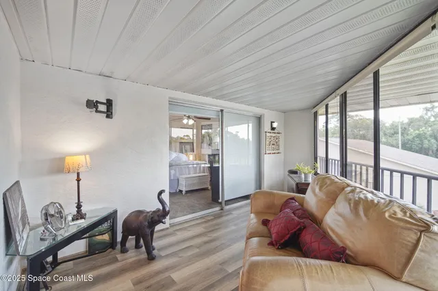 a living room with furniture a window and a table