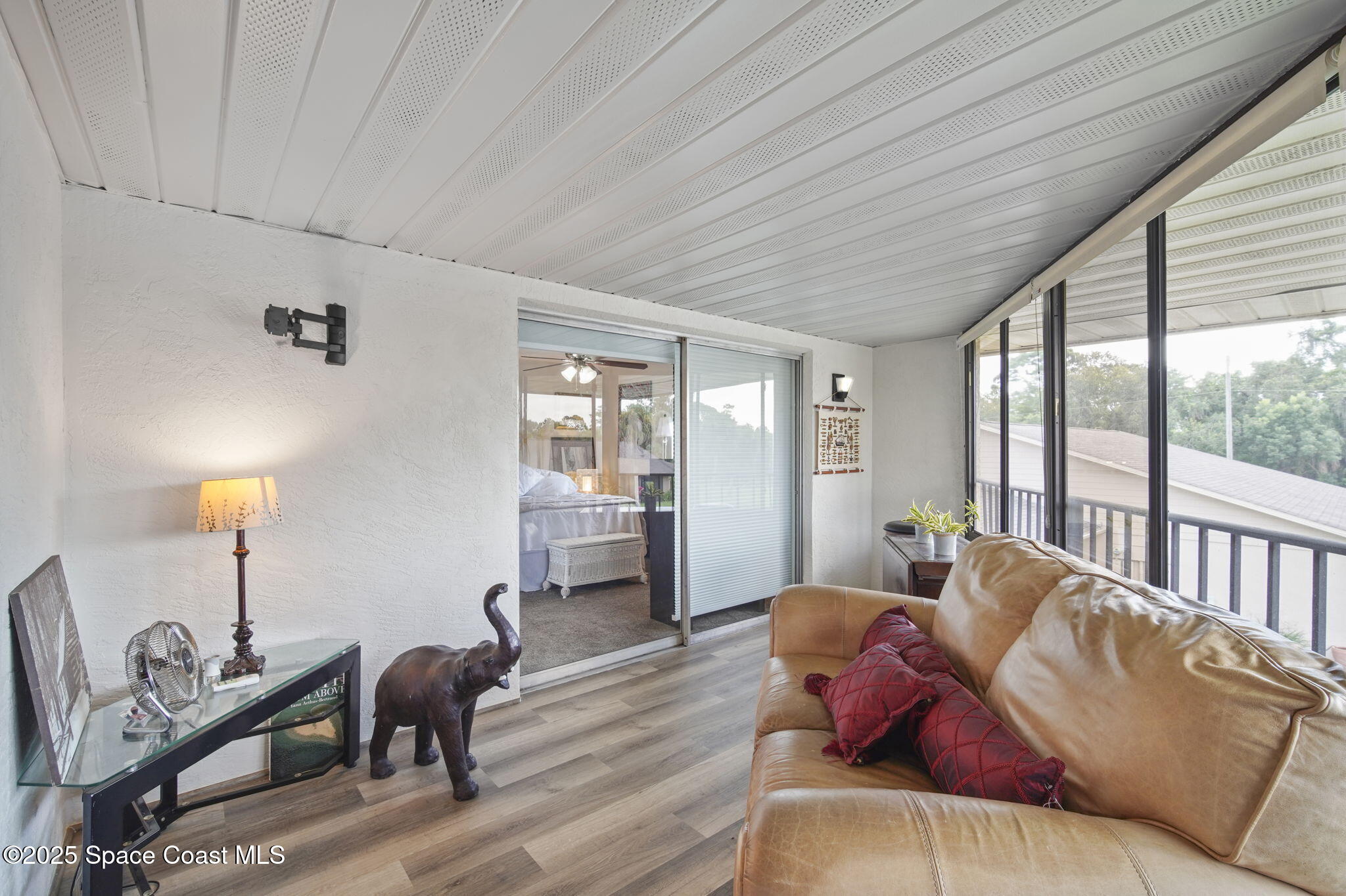 4148 Prime Avenue, Unit 1504 Rockledge, FL 32955 - Photo 28 of 30 a living room with furniture a window and a table
