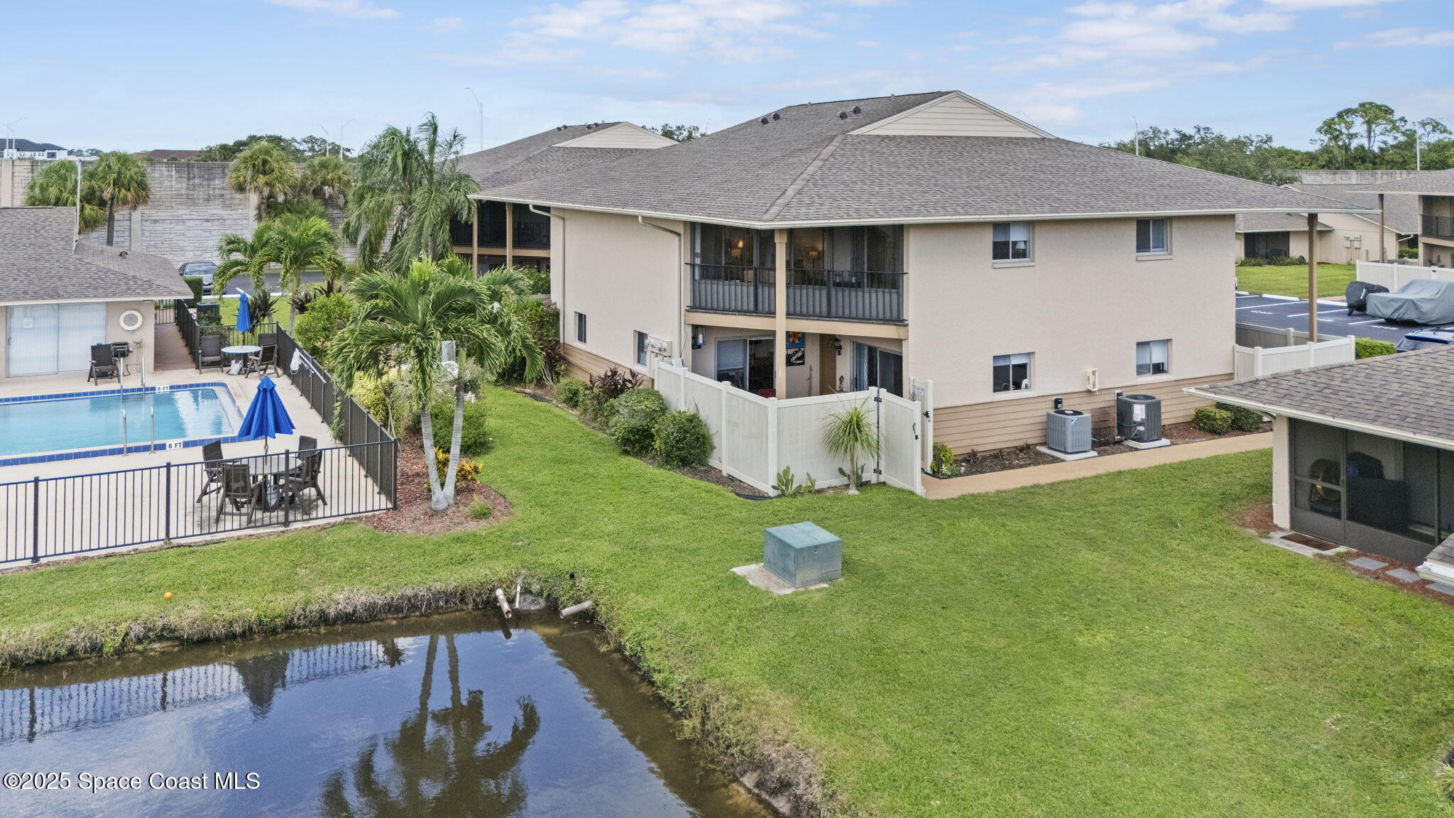 4148 Prime Avenue, Unit 1504 Rockledge, FL 32955 - Photo 30 of 30 a view of a house with backyard and sitting area