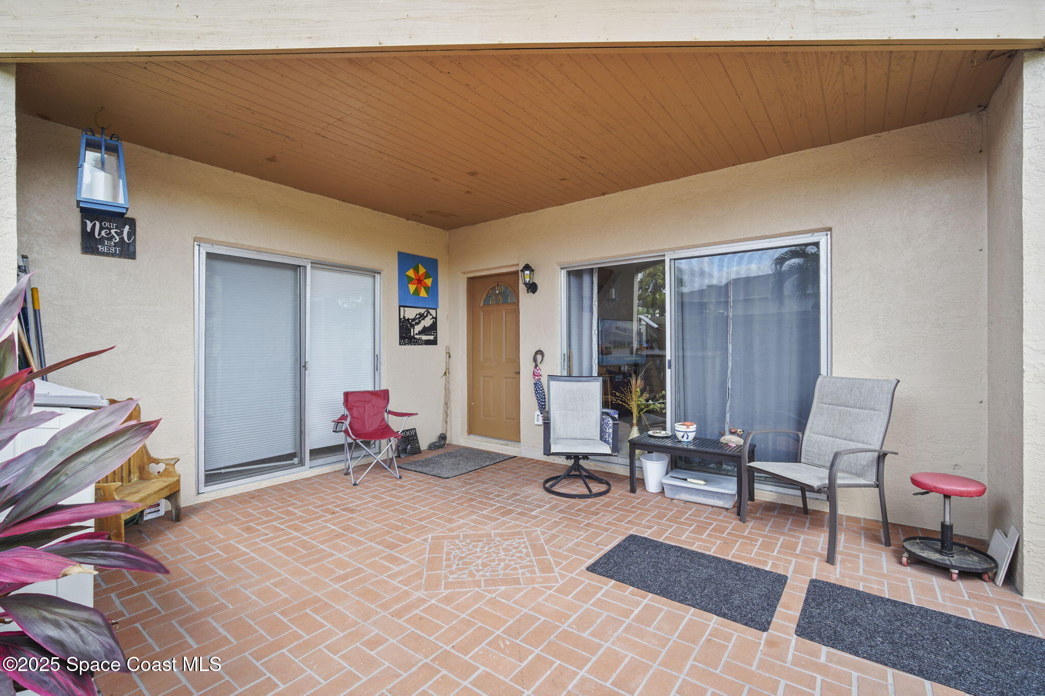 4148 Prime Avenue, Unit 1504 Rockledge, FL 32955 - Photo 6 of 30 a living room with furniture a rug and white walls