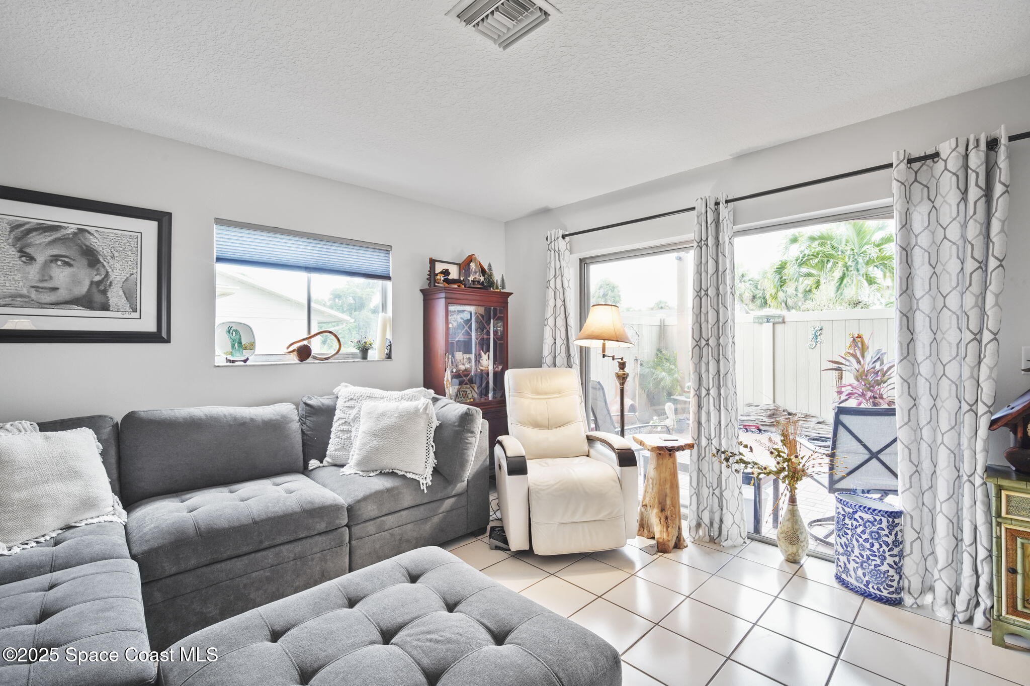 4148 Prime Avenue, Unit 1504 Rockledge, FL 32955 - Photo 10 of 30 a living room with furniture and a large window