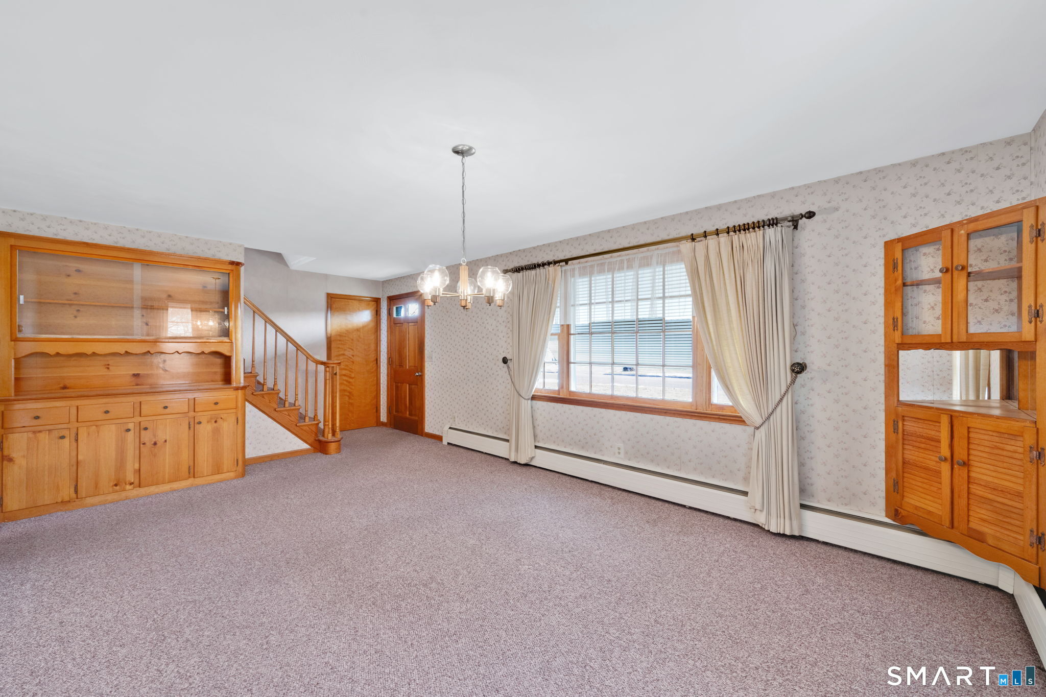 10 Helena Lane Windsor Locks, CT 06096 - Photo 11 of 36 a view of an empty room with a window and wooden floor