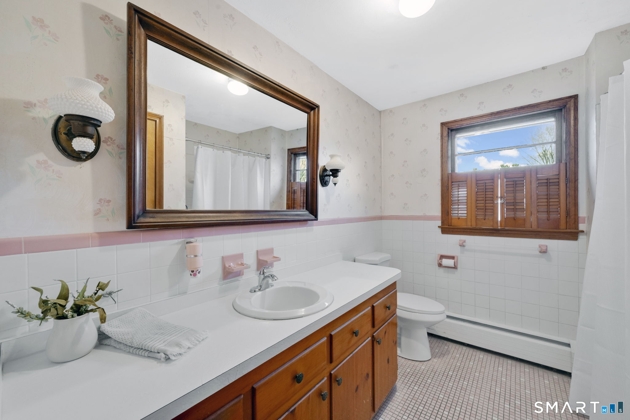 10 Helena Lane Windsor Locks, CT 06096 - Photo 15 of 36 a bathroom with a granite countertop sink mirror and vanity